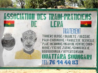 Roadside advertisement of healer and soothsayer Ouattara Soungari in Lera (Senufo tribe), Burkina Faso.