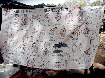 Advertisement of the traditional healer Amadou Jebre in a market in Toumousseni, Burkina Faso.