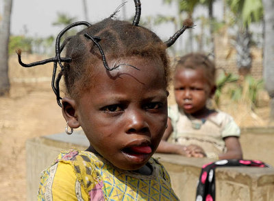 Fancy hairstyle of a little girl in Burkina Faso