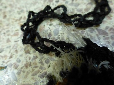 Frayed corner of carpet, more detail