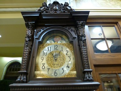Clock with very interesting wood carving
