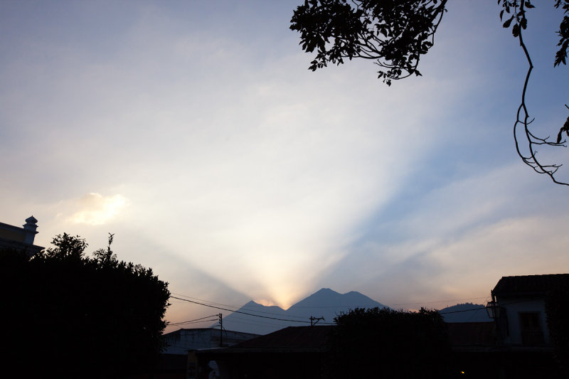 Sunset light breaking through the Volcan de Fuego.