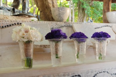 White brides bouquet and eggplant bridesmaids bouquets. By: Kate Bahnsen