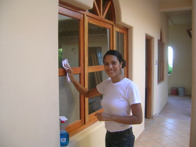 Alma, our first house keeper, cleaning the windows