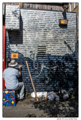 Clarion Alley muralist at work.jpg