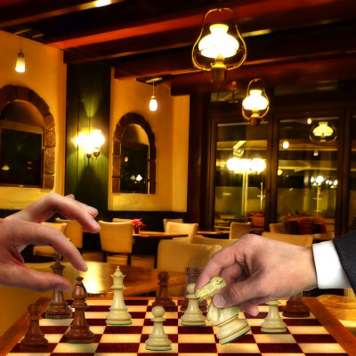 Two workers in a Southern caf, enjoying a silent game of chess.