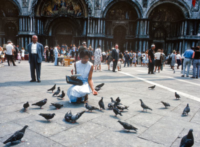 Wife feeding pigeons in Piazza San Marco