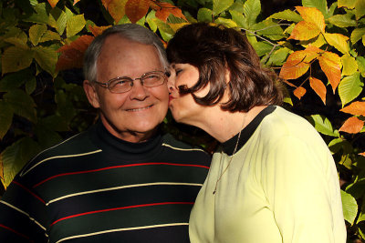 Angela sneaks a kiss from her sweetheart