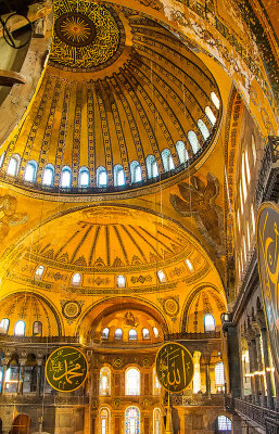 The triangular concave areas at the base of the dome are Mosaics of six winged seraphim