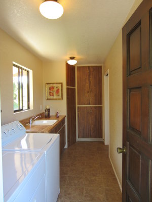 Entry through laundry room into kitchen