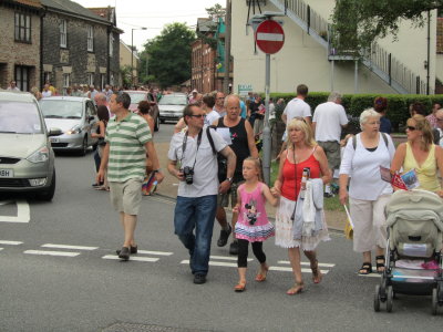 The Stragglers - Crowds Following the Procession