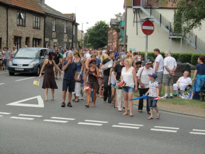 The Stragglers - Crowds Following the Procession