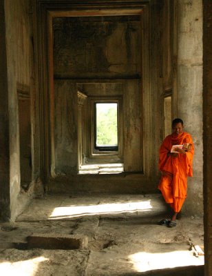 Lone Monk, Angkor Wat, Cambodia. Not exactly the most peaceful place to study, but good if you want your photo taken...