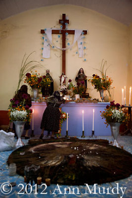 Adding candles to the altar