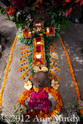 Decorated grave with floral cross