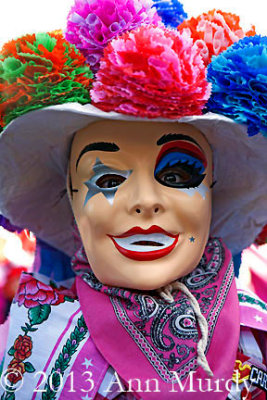 Child masked dancer in parade