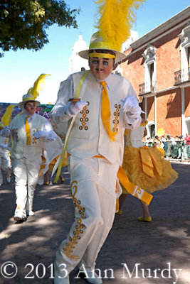 Dancers in white on plaza