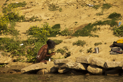 Lone sadhu on the river.jpg