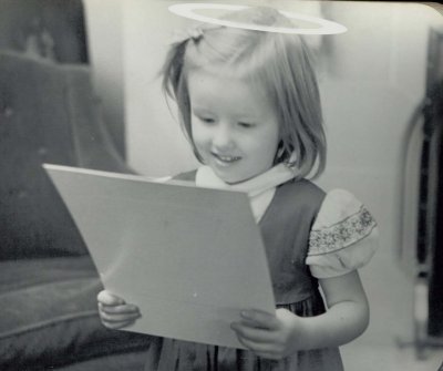Mary reading what she insists is a confession from her brother.  Unfortunately, the original text is unknown.  (c. 1944)