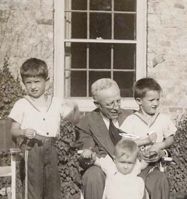 Grandfather Scott with Bill, Rick, and Mary -- and eggs.  (1945)