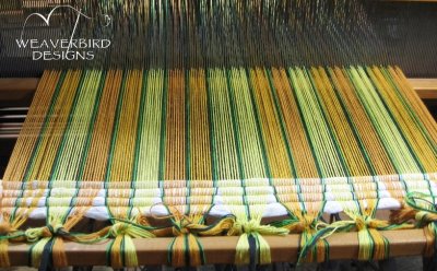 Header woven in to spread the warp