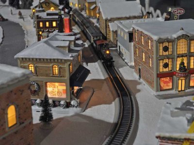 Train comes down the track on Jim's Christmas layout