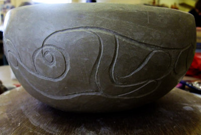Hand-built bowl now with carved decoration 