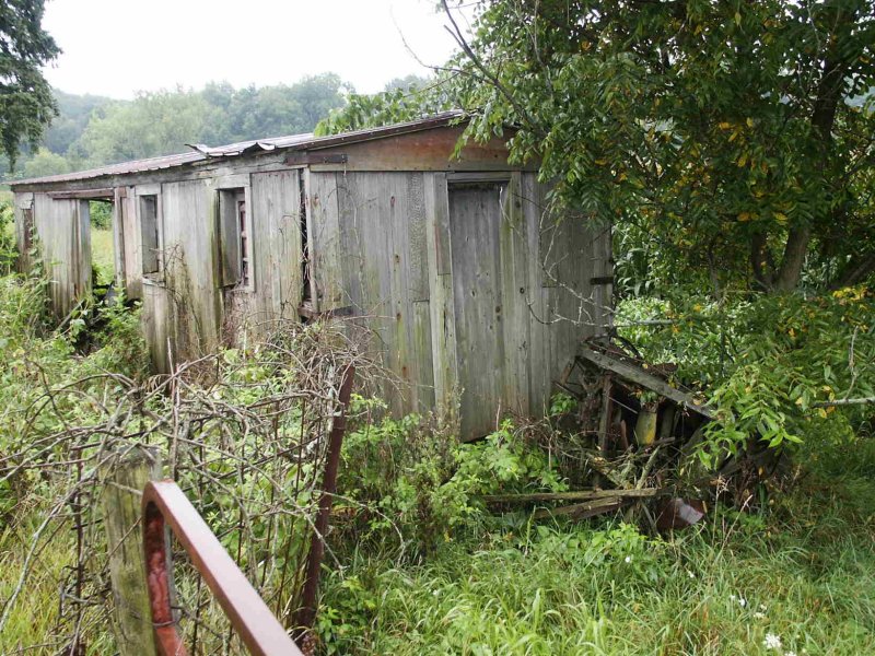 Wooden boxcar used as a farm shack