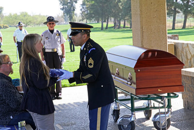 Presenting flag to Sam's daughter
