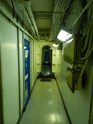 CVN-65 196 Start of 1000 ft hallway watch the blue curtain.JPG