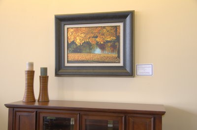 Fall Tree at the River framed on display at Sofa Solutions