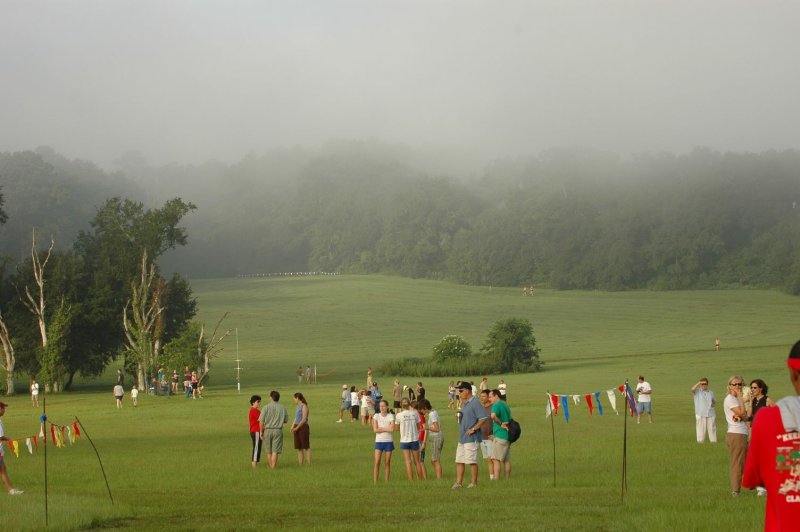 Spectators wait for runners