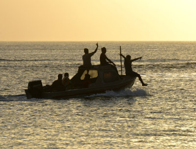 Spotting a tourist, they give friendly waves