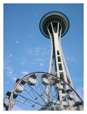 The Space Needle Rises Above Seattle Center Ferris Wheel