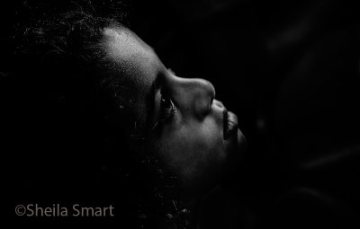 Little girl watching busker in monochrome