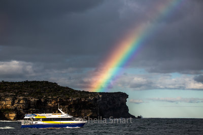Manly fast ferry with rainbow on Sydney Harbour