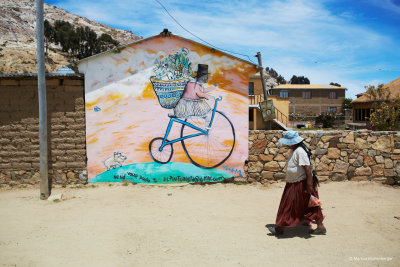 and a lady infront of a painting