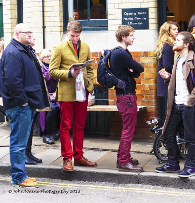 Blokes in Colourful Trousers in a Queue