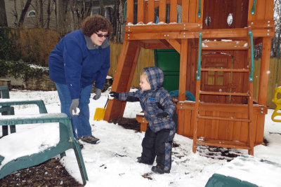 You're supposed to throw the snowball, not hand it to mom.   IMG_0189c.jpg