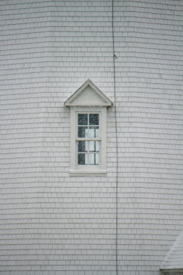 lighthouse window in the snow storm