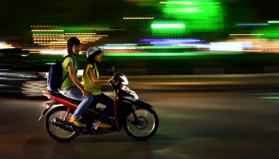 two girls on scooter, Saigon, Vietnam  
