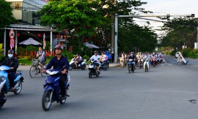 crossing Nguyen Van Linh street, Saigon, Vietnam 