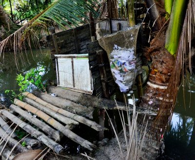 toilet over pond, Phu Long, Ben Tre, Vietnam 