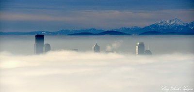 Tall buildings over Seattle, Olympic Mountains, Washington 