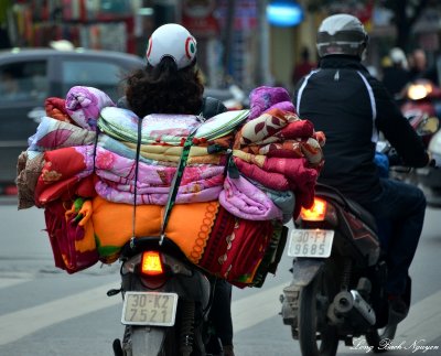 blankets on scooter, Hanoi, Vietnam 