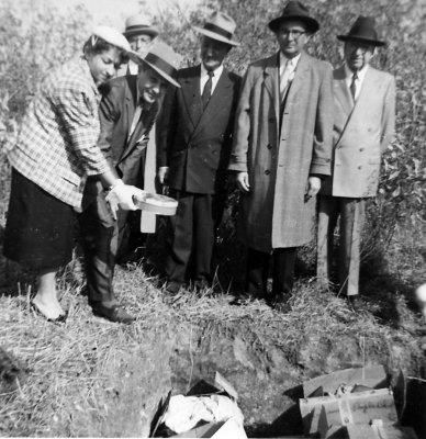 Burying her father's effects - Chicago 1950s