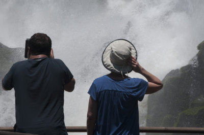 Jill and an unidentified man looking at Iguazu Falls