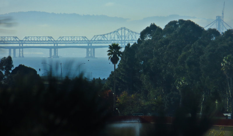 Morning. 500mm handheld zoom-in on Bay Bridge. Day 2, w/ default compression. 0136