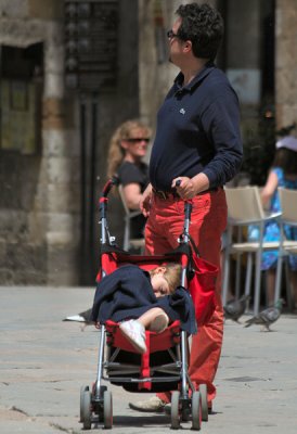 Unimpressed child.  Colorful pants, certainly.