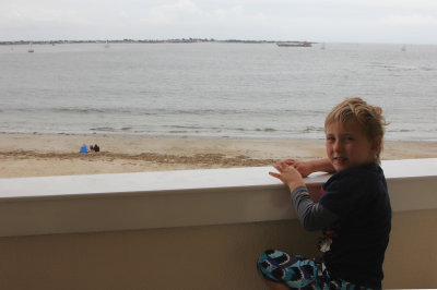 Toby looking out from the balcony at Lamour Plage